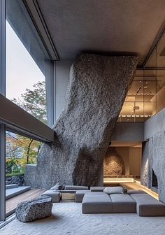 a living room filled with furniture and large rocks