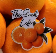 the sweet life sticker is on top of oranges