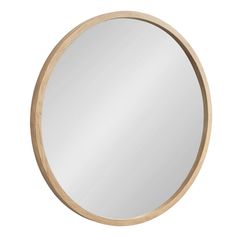 the round mirror is made from wood and has a light colored frame with a wooden edge