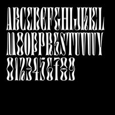 the upper and lower case of an old fashioned typeface in white on a black background