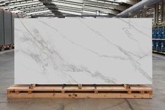 a large white marble slab in a warehouse