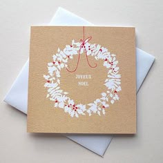 a card with a christmas wreath on it