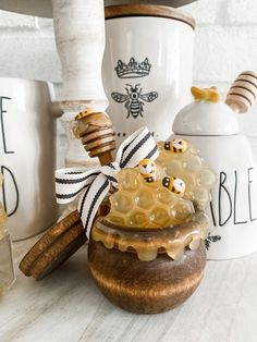 some jars with honey and bees on them