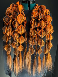 A set of two, black and neon orange, bubble braided ponytail hair extensions perfect for Halloween! These braided hair extensions, also known as festival braids, are the perfect accessory to elevate your hairstyle for any occasion. Made from high-quality synthetic hair, these extensions are soft, silky and easy to wear.  Our braids are perfect for festivals, concerts, raves, cosplay or any event where you want to stand out in the crowd. They are easy to install and are perfect for those who want Halloween Hair Extensions, Rave Hair Extensions, Orange Braids, Braided Hair Extensions, Rave Braids, Festival Braids, Halloween Rave, Rave Hair, Bubble Braids