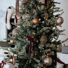 a decorated christmas tree with presents under it