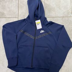 New With Tags Affordable Navy Nike Tops, Nike Tech Fleece Colors, Nike Tech Bleu Marine, Blue Sporty Hoodie For Outdoor, Fleece Hooded Sweatshirt For Jogging, Blue Activewear With Drawstring Hood For Fall, Sporty Blue Hoodie For Outdoor, Nike Hooded Activewear For Jogging, Blue Fleece Sportswear Outerwear