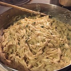 a pan filled with pasta on top of a stove