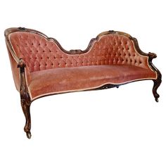 an old style couch with wooden frame and leather upholstered back, on white background