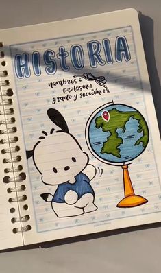 a notebook with a drawing of a cartoon character holding a globe on it's cover