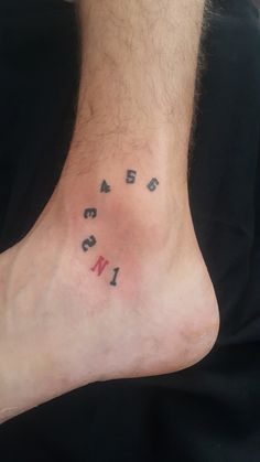 a man's foot with the word love written in small letters on his left side