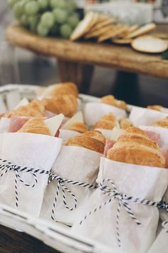 bread wrapped in paper sitting on top of a table