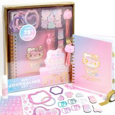 the hello kitty stationery set is in its box and includes accessories like scissors, hair clips, bracelets, eyeglasses