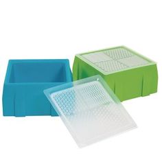 two plastic trays sitting next to each other