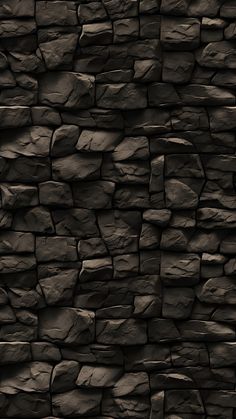 a black stone wall is shown in this dark photo, it looks like an old rock wall