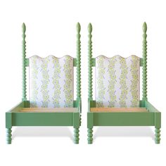 a pair of green twin beds sitting next to each other