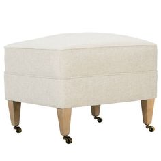 a white ottoman with wheels on it