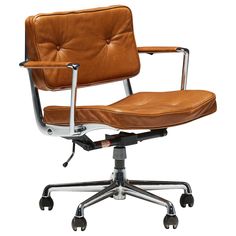 a brown leather office chair sitting on top of a metal base