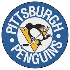 the pittsburgh penguins logo is shown on a blue and white circle with an image of a penguin holding a hockey stick