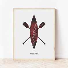 a red canoe with two paddles on it and the words winner written in black ink