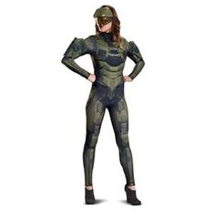 a woman in a green camo suit standing with her hands on her hips