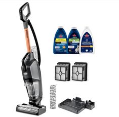 an image of a vacuum cleaner and cleaning supplies