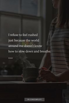 a woman sitting at a table with a cup in front of her and the words, i refuse to feel ruined just because the world around me doesn't know how to slow down and breathe