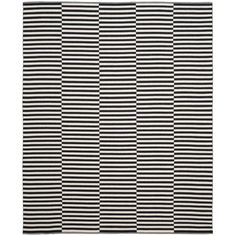 a black and white rug with vertical stripes