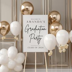 a graduation party sign surrounded by balloons and streamers