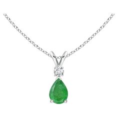 This classic solitaire pendant features a pear-shaped emerald, secured in a prong setting. A brilliant round diamond sits atop the lush green gemstone adding to the design's beauty. Simple yet alluring, this emerald pendant in platinum is crafted with a lustrous v-bale. Available in different carat weight. Emerald is the Birthstone for May and traditional gift for 20th, 35th & 38th wedding anniversaries. Free Certificate of Authenticity. All items are packaged with care in appealing boxes with plush interiors. Pear-shaped Emerald Necklace In White Gold, Luxury Teardrop Emerald Pendant Necklace, Luxury Teardrop Pendant Emerald Necklace, Luxury Elegant Pear-shaped Emerald Necklace, Luxury Pear-shaped White Gold Emerald Necklace, Antique Pendant, Vintage Necklaces, Emerald Pendant, Solitaire Pendant