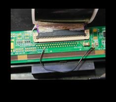 an electronic board with wires attached to it