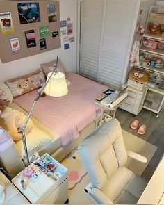 a room with a bed, desk and chair