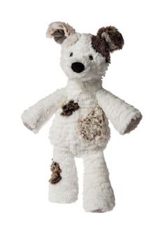 a white stuffed animal with brown spots on it's face and ears, standing upright