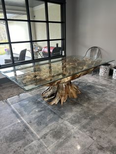 a glass table sitting in the middle of a room