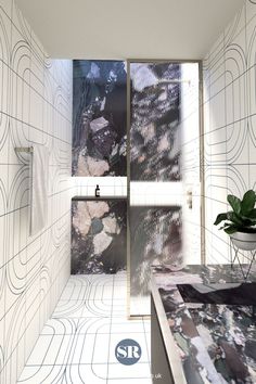 the bathroom is decorated in white and black with an abstract pattern on the wall behind it