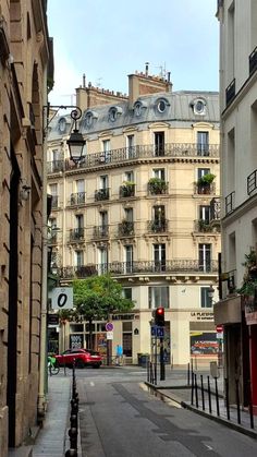 an empty city street lined with tall buildings