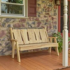 a wooden bench sitting on top of a hard wood porch