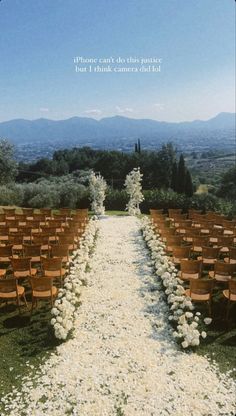 the aisle is lined with wooden chairs and white flower petals on each side, as well as an inscription that reads, phone can't do this route but i think camera did not