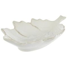 a white leaf shaped bowl on a white background