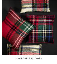 three red and green plaid pillows with the words, shop these pillows > $ 10