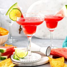 watermelon and lime margaritas with tortilla chips on the side for garnish