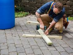 a man is working on some wooden planks