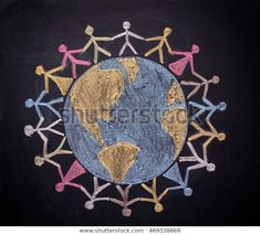 people holding hands around the world drawn on a blackboard royalty photo