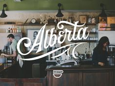 two people sitting at a bar with the word albareta written in cursive font