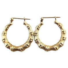 14 Karat Yellow Gold Bamboo Hoop Earrings These beautiful 14K yellow gold bamboo hoops are going to look amazing on you! Size: 23.3mm X 21.87mm X 3.85mm Weight: 1.53 g/ 0.99 dwt Hallmark: 14K Very good condition, professionally polished. Will come packaged in a gift box or pouch (when possible) and will be shipped U.S. Priority Mail Insured. MM092524/17KCS 90's Bamboo Earrings Outfit, Bamboo Earrings Aesthetic, Bamboo Earrings Heart, Real Gold Bamboo Earrings, 90s Bamboo Earrings, Gold Bamboo Earrings, Bamboo Hoop Earrings, Bamboo Earrings, Funky Jewelry