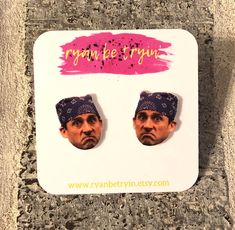 two stickers with the faces of two men wearing bandannas on top of each other