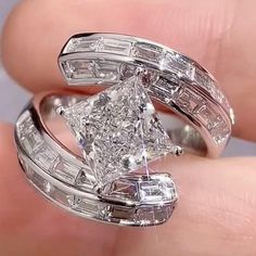 7 mm Princess Cut Moissanite Diamond Ring, Knife Edge Baguette Bypass Engagement Ring, 18k White Gold Party Wear Wedding Ring, Gift For Her ✹✹𝐖𝐞𝐥𝐜𝐨𝐦𝐞 𝐭𝐨 𝐂𝐫𝐚𝐳𝐲𝐃𝐢𝐚𝐦𝐨𝐧𝐝𝐬𝐂𝐨✹✹ Detail about stones Moissanite & Simulated Stone: ----------------------------- Stone Shape: Princess Cut Stone Size: 7 mm Weight: 2 CT Color: Colorless Cut: Excellent Clarity: VVS ★ 𝑰𝒕𝒆𝒎 𝑫𝒆𝒕𝒂𝒊𝒍𝒔:- ☛ Metal Purity: Solid Gold (10KT, 14KT, 18KT); Silver(925 Sterling, 935 Argentium), 950 Platinum ☛ Metal Tone: Yellow, White, Rose ☛ Stamp/Hallmark: Yes ★ 𝑪𝒖𝒔𝒕𝒐𝒎𝒊𝒛𝒂𝒕𝒊𝒐𝒏:- ☛ Customized Design Jewelry. ☛ All cuts which you dream to make with moissanite. ☛ Updating every step of your ordered jewelry(Loose Stone, CAD & Making Process) ☛ All listed items in our stores are made to order Ring Knife, Bypass Engagement Ring, Princess Cut Moissanite, Sf 49ers, Side Stone Engagement Ring, Moissanite Diamond Rings, Vs Diamond, Gold Party, Jewelry Images