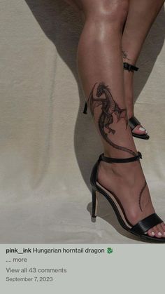 a woman's legs with tattoos on them