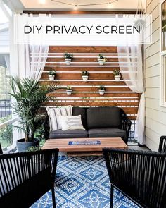 an outdoor living area with couches, chairs and potted plants on the deck