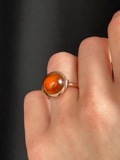 This modern take of cocktail ring is captivating with its honey warm hessonite garnet. Wear it for an iconic, style defining presence.  Known as a Stone of Whole Harmony, this ring harmoniously will match any look. Hessonite garnet cabochon 12 mm 9K solid rose gold Follow us on Instagram: https://www.instagram.com/missionewyork/ Sphere Ring, Silk Bracelet, Gold Statement Ring, Hessonite Garnet, Handmade Fine Jewelry, Solid Gold Chains, Gold Silk, Iconic Style, Woven Bracelets