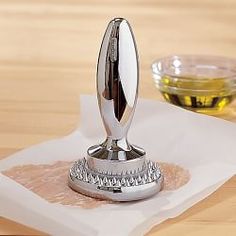 a silver object sitting on top of a napkin